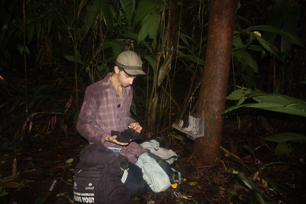 Christopher Jordan preparing a wildlife camera